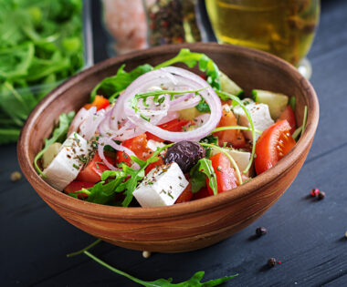 Mediterranean Greek salad with feta, olives, tomato, cucumber, and arugula — a healthy, hormone-balancing recipe for women in perimenopause and menopause.