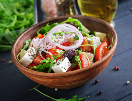 Mediterranean Greek salad with feta, olives, tomato, cucumber, and arugula — a healthy, hormone-balancing recipe for women in perimenopause and menopause.