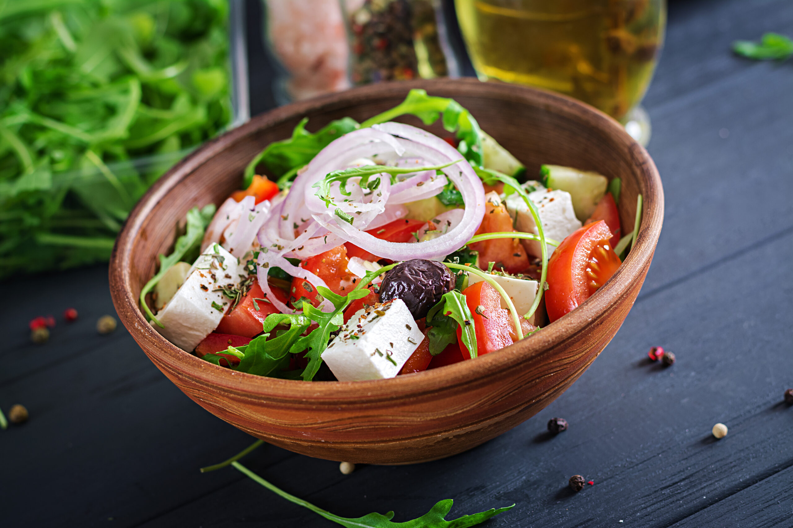 Mediterranean Greek salad with feta, olives, tomato, cucumber, and arugula — a healthy, hormone-balancing recipe for women in perimenopause and menopause.