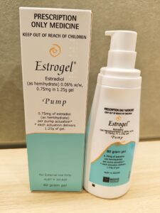 Estrogel 80-gram pump dispenser and box showing dosage information and labeling for prescription hormone replacement therapy containing estradiol.