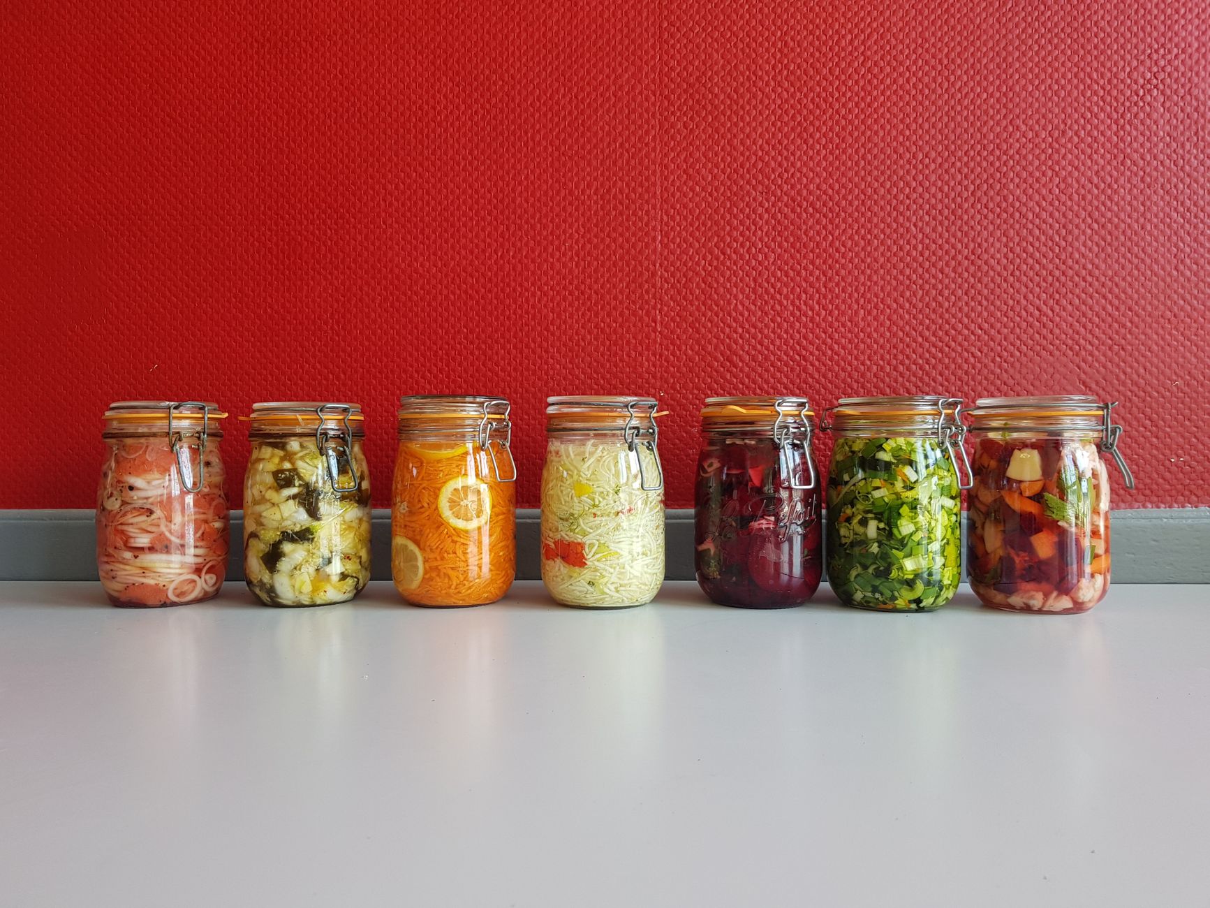 colorful fermented vegetables in mason jars